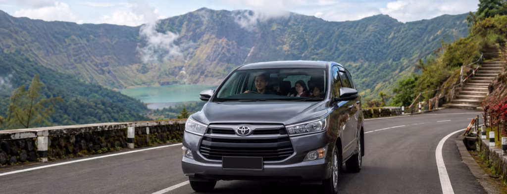 Private driver trip from Bandung to Galunggung Tasikmalaya with a comfortable family car on a scenic mountain road