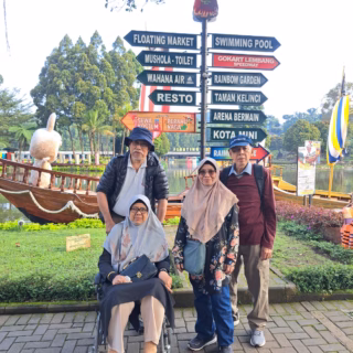 Family with elderly member in wheelchair visiting Floating Market Lembang, guided by Bandung Driver.