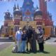 Family posing in front of the colorful fairytale castle at D’Castello Lembang Bandung