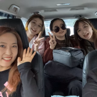 Bandung female driver with female passengers enjoying a comfortable car rental trip in Bandung