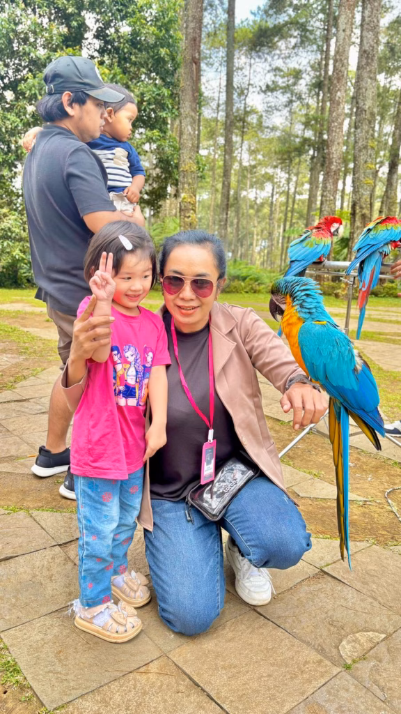 Bandung female driver enjoying a family-friendly tour with a child at a nature park in Bandung