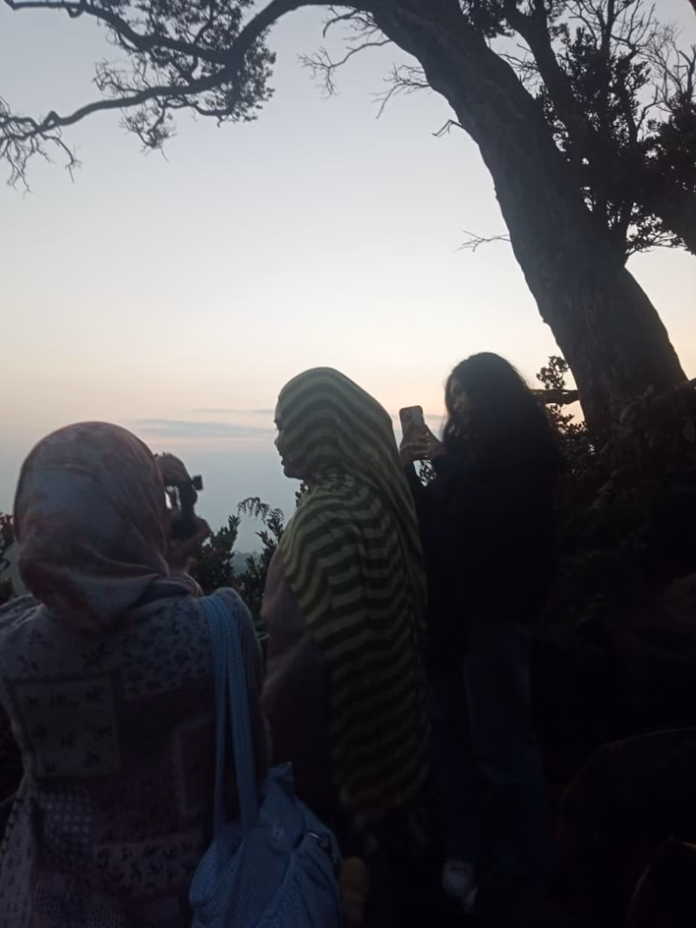 Travelers enjoying sunrise at Sunan Ibu viewpoint near Kawah Putih Ciwidey Bandung