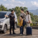 Private driver in Bandung welcoming China visitors at a safe scenic parking area
